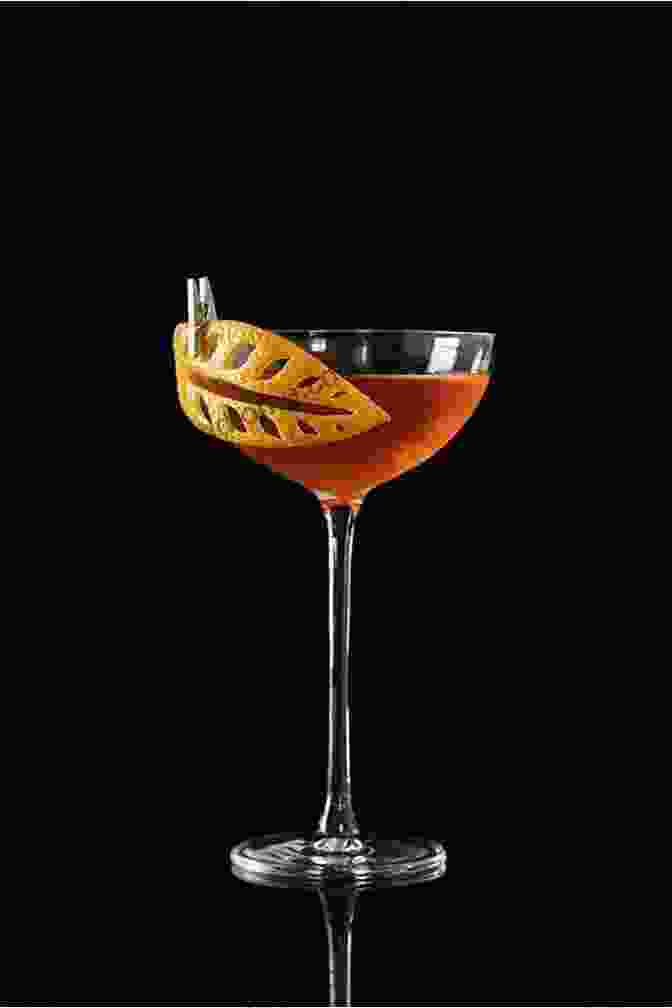 A Beautifully Garnished Cocktail In A Frosted Glass, Emphasizing The Importance Of Presentation In Mixology. Whiskey Cocktails: A Complete Recipe To Discover The Secrets And Techniques On How To Mix All Whiskey Based Drinks For The Home Bartender