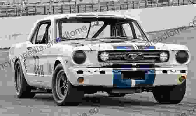 Carroll Shelby Standing In Front Of A Group Of Race Cars Inside Shelby American: Wrenching And Racing With Carroll Shelby In The 1960s